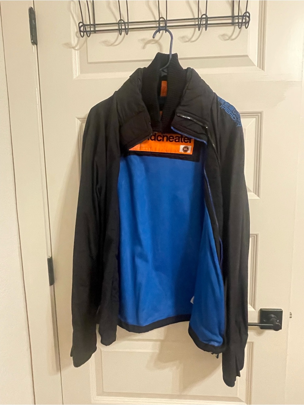 Superdry Men's Black Ski Jacket with Bright Blue Lining and Orange Trim